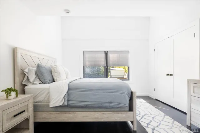 a bathroom with a sink mirror and toilet