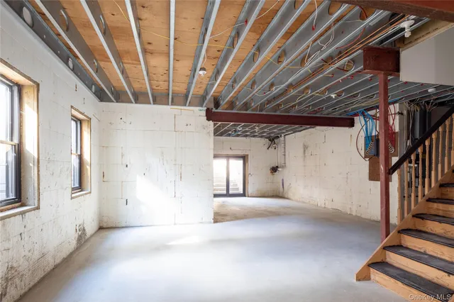 an aerial view of a houses with a lake