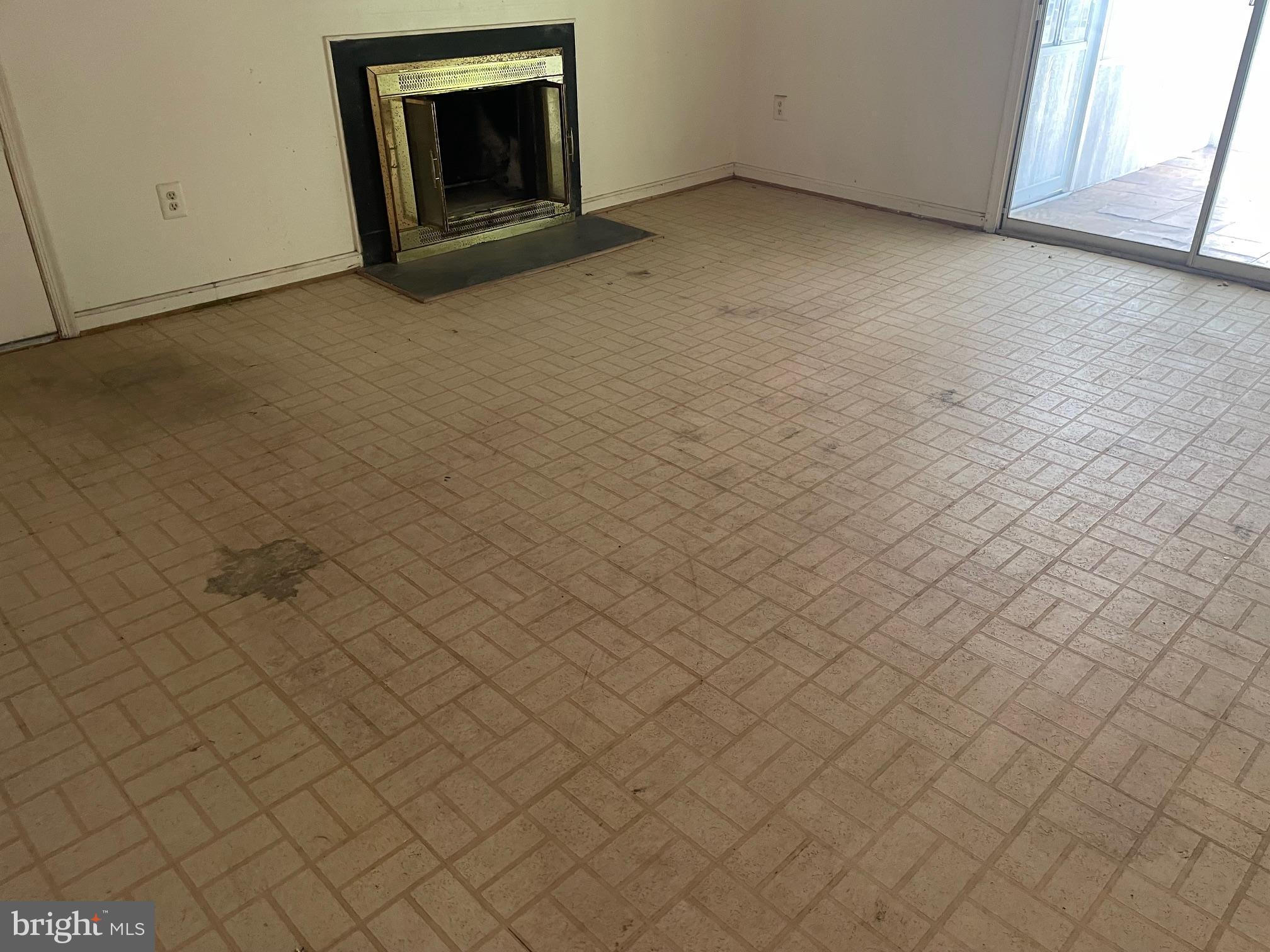 13403 Pendleton Street Fort Washington, MD 20744 - Photo 4 of 19 a view of an empty room with brick wall and a window
