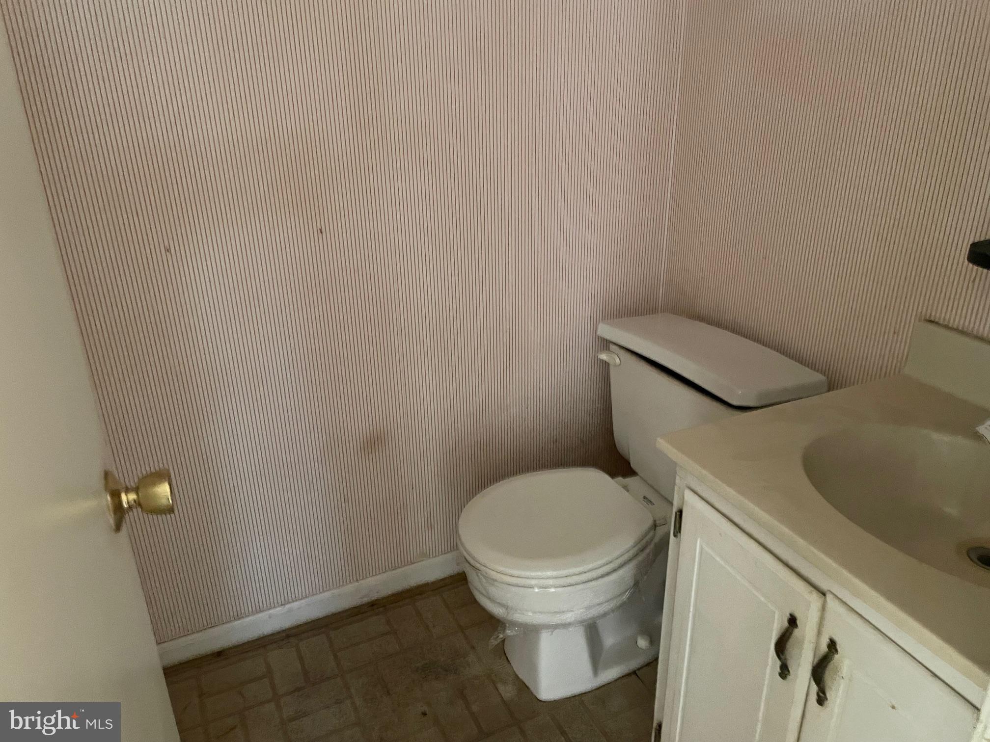 13403 Pendleton Street Fort Washington, MD 20744 - Photo 7 of 19 a white toilet sitting next to a sink