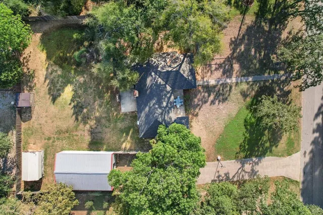 a view of a city with lush green forest