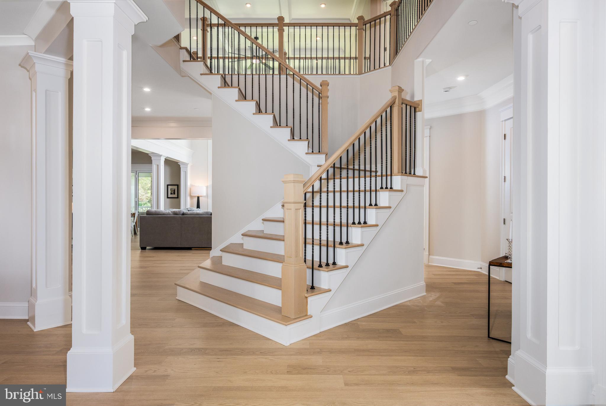 13405 Query Mill Road North Potomac, MD 20878 - Photo 6 of 57 Grand Foyer w/ Mohawk Laminate Flooring throughout