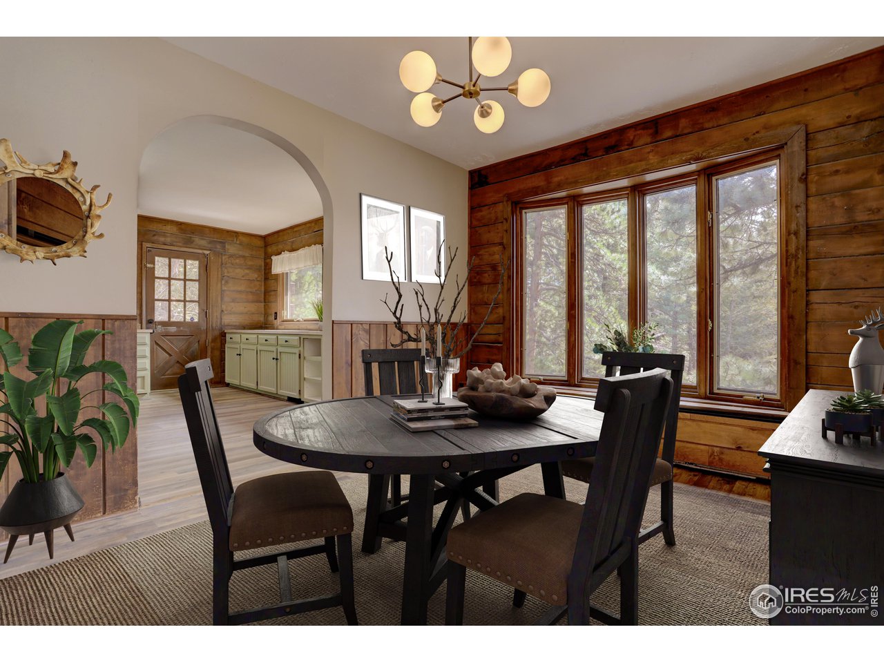 601 Pika Road Boulder, CO 80302 - Photo 13 of 38 a view of a dining room with furniture a chandelier and wooden floor