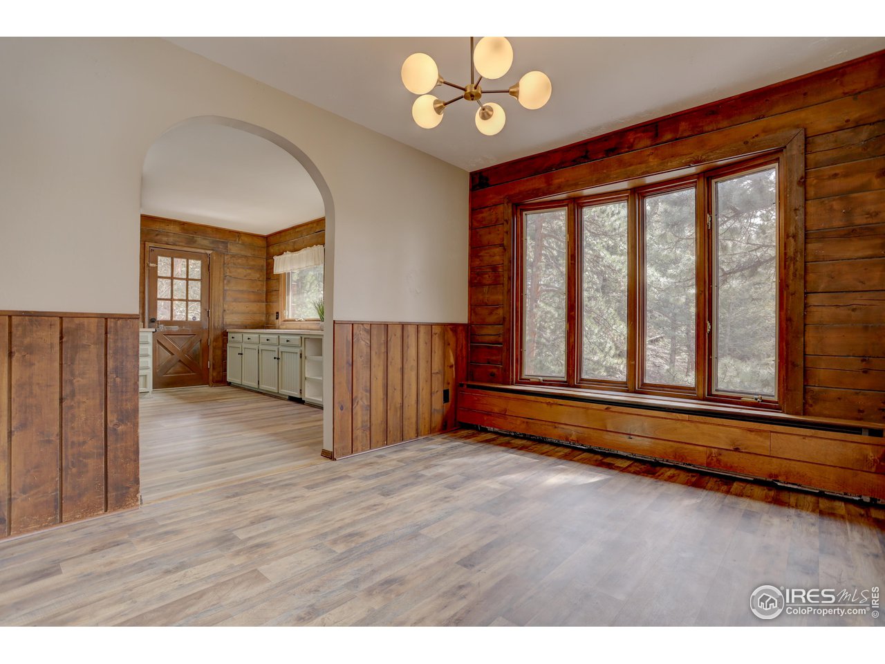601 Pika Road Boulder, CO 80302 - Photo 14 of 38 wooden floor in an empty room with a window