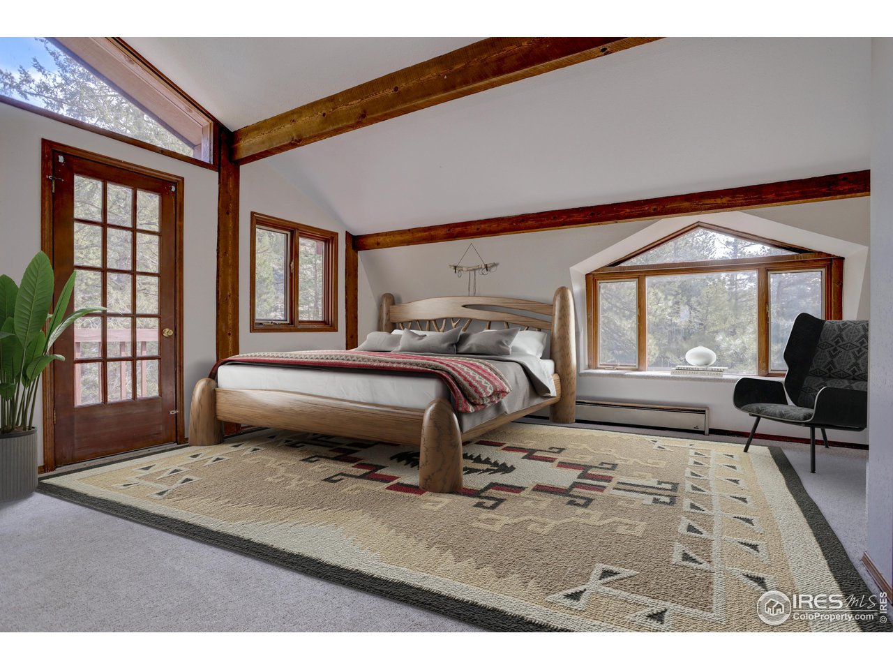 601 Pika Road Boulder, CO 80302 - Photo 15 of 38 a bedroom with a bed and a large window