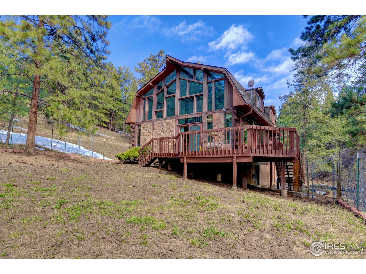 601 Pika Road Boulder, CO 80302 - Photo 30 of 38 a view of house with yard and sitting area