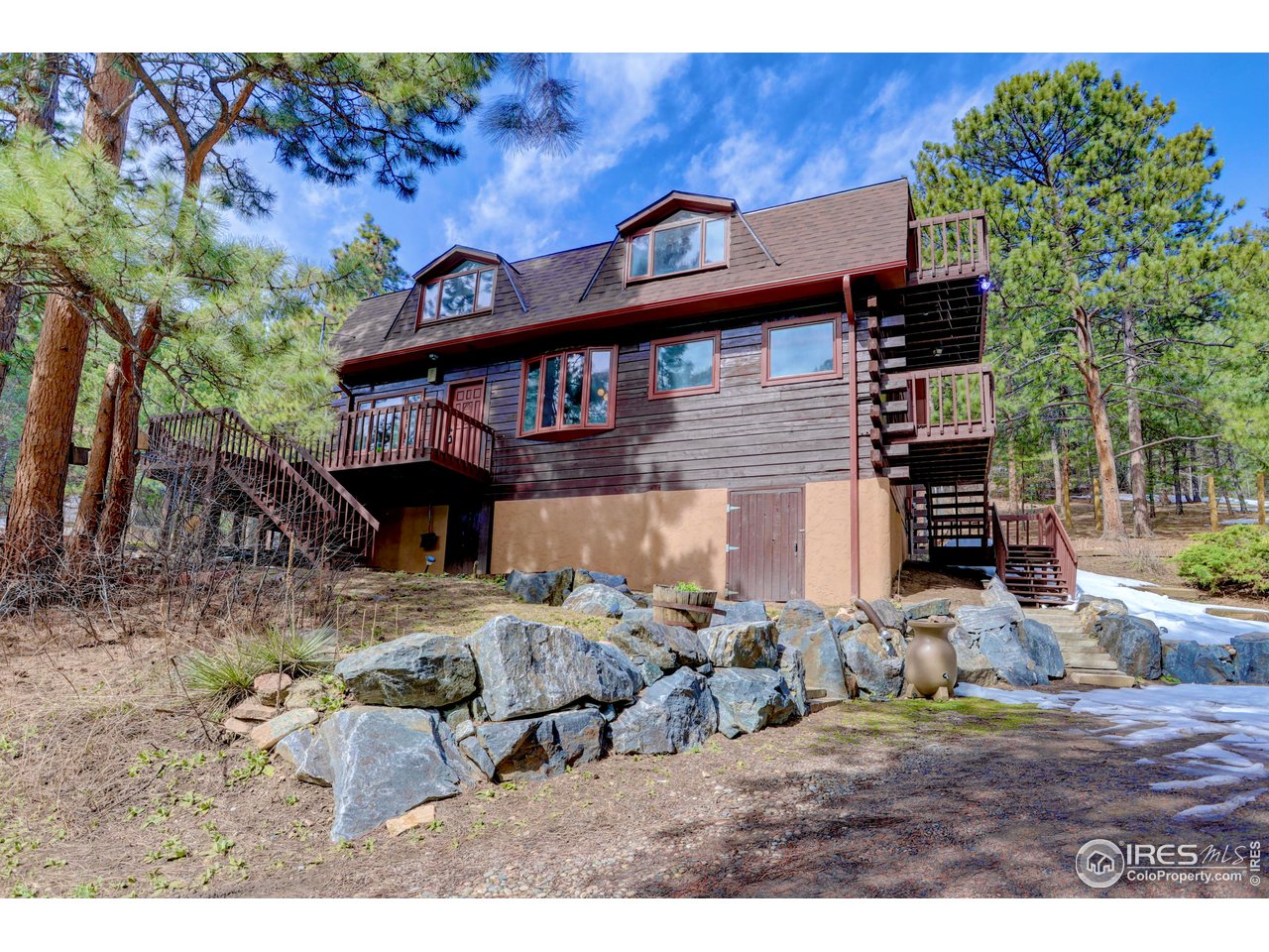 601 Pika Road Boulder, CO 80302 - Photo 31 of 38 a view of a house with a yard
