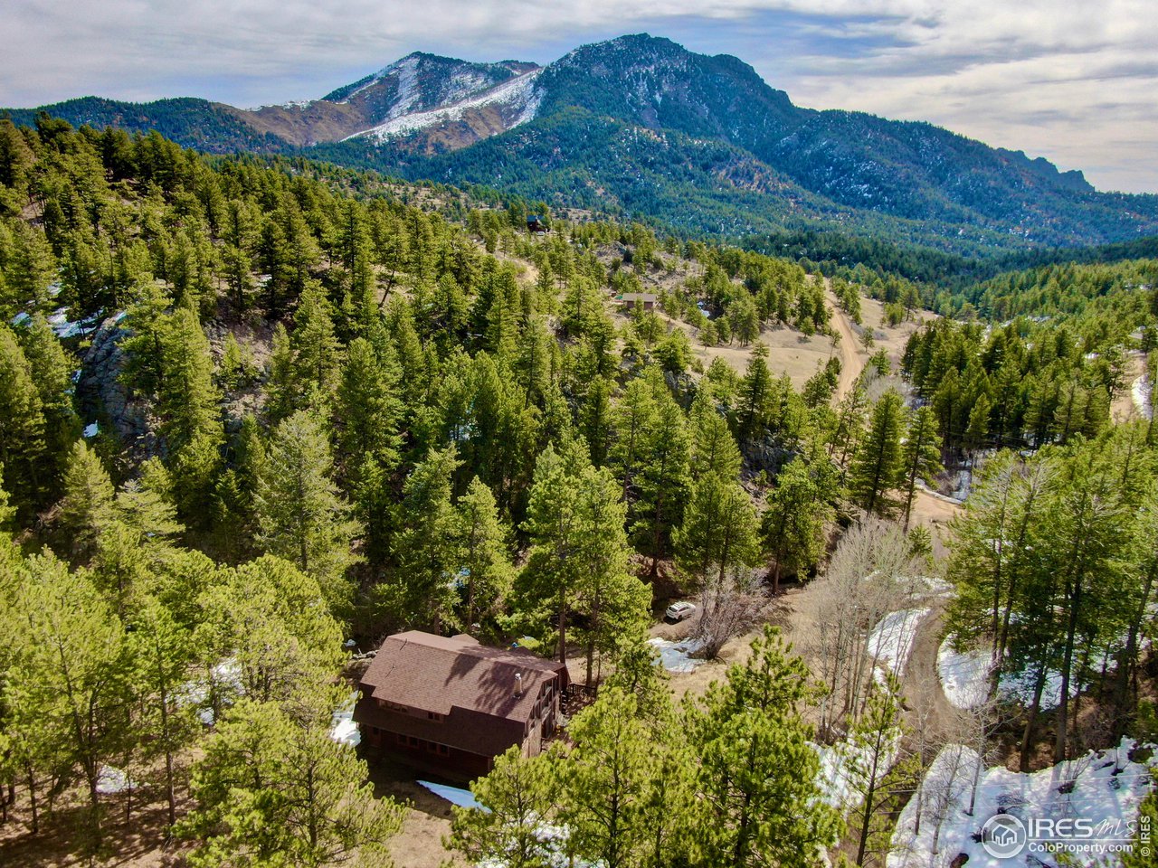 601 Pika Road Boulder, CO 80302 - Photo 37 of 38 a view of a lush green hillside and a houses