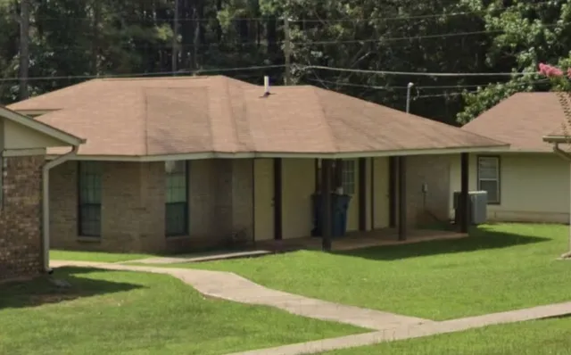 a house with a garden in front of it