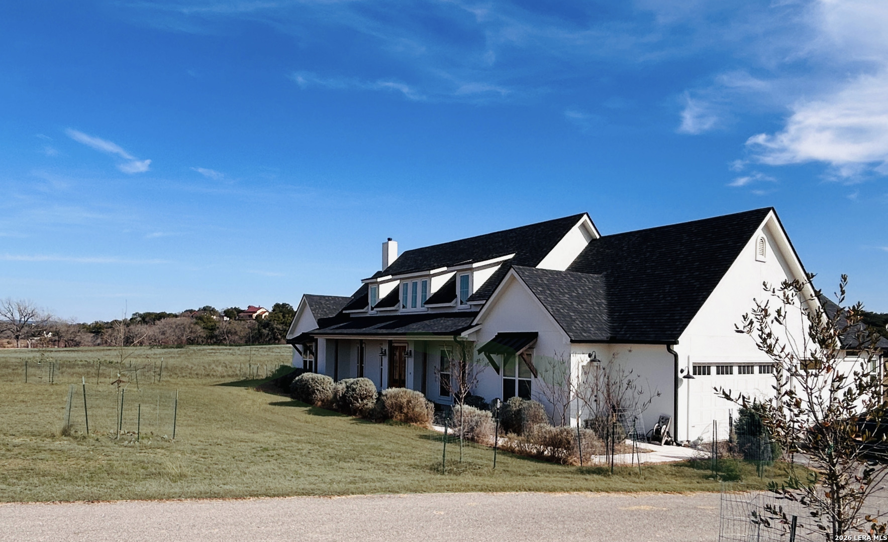 450 Lucky Ridge Bandera, TX 78003 - Photo 2 of 8 a front view of a house with a yard