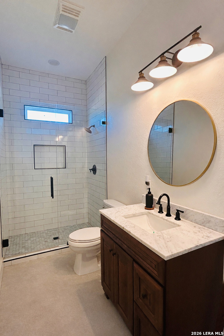 450 Lucky Ridge Bandera, TX 78003 - Photo 6 of 8 a bathroom with a sink a toilet and shower