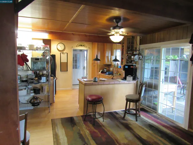 a kitchen with a stove and a refrigerator