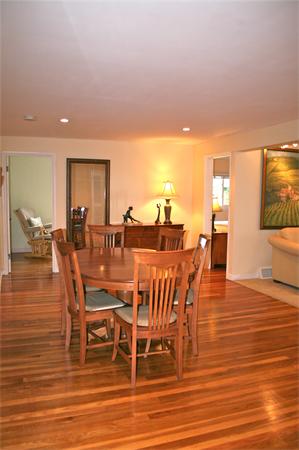 21 Harwood Road Natick, MA 01760 - Photo 7 of 20 a dining room with furniture a chandelier and wooden floor