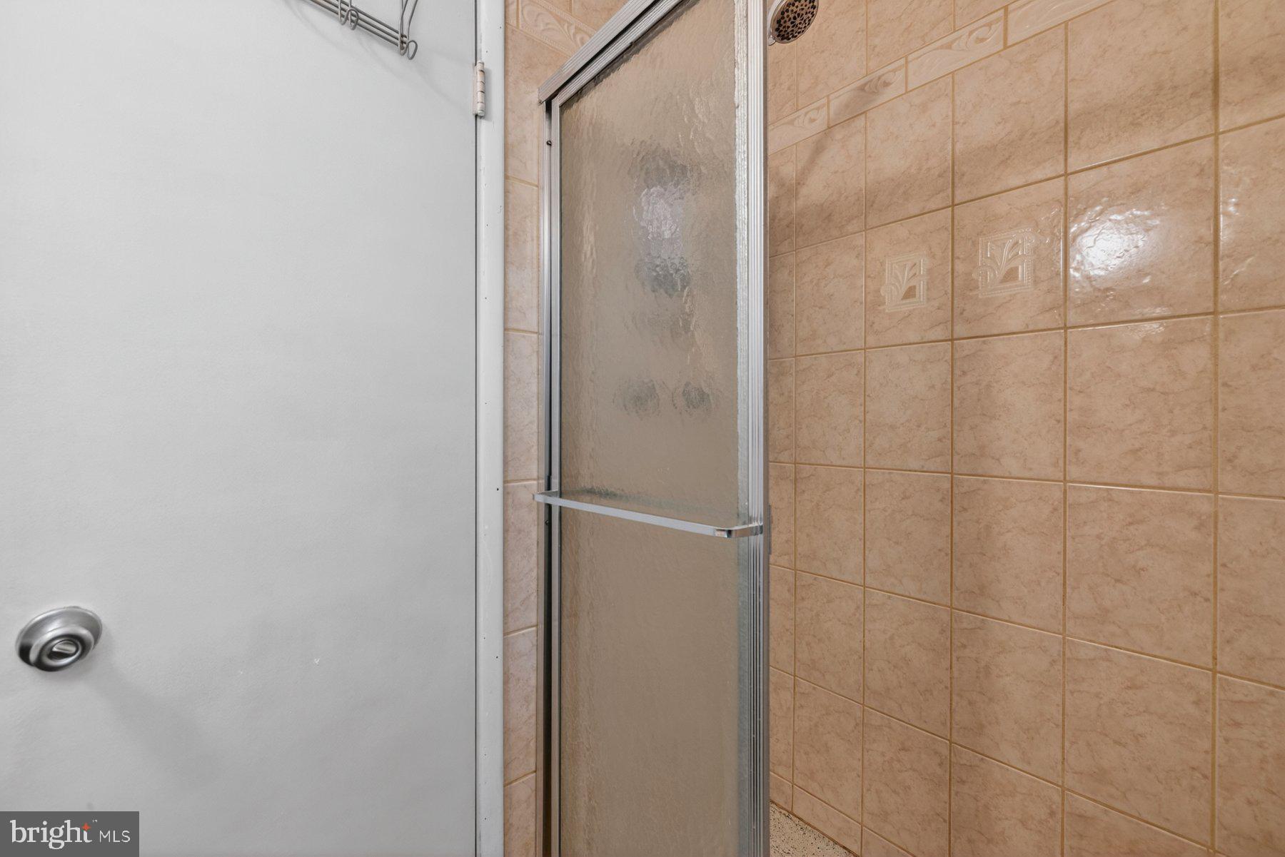 2311 Coleridge Drive Silver Spring, MD 20910 - Photo 21 of 47 Modern shower with tiled elegance.