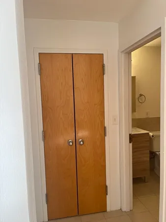 a bathroom with a refrigerator