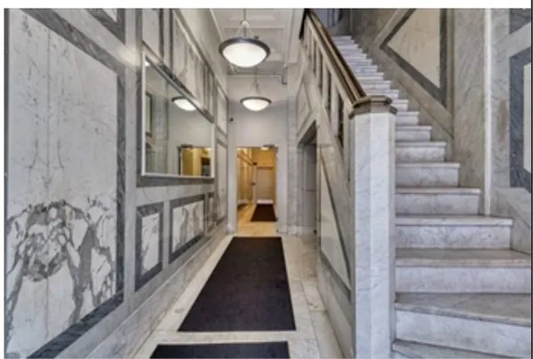 a front view of a building with retail shops