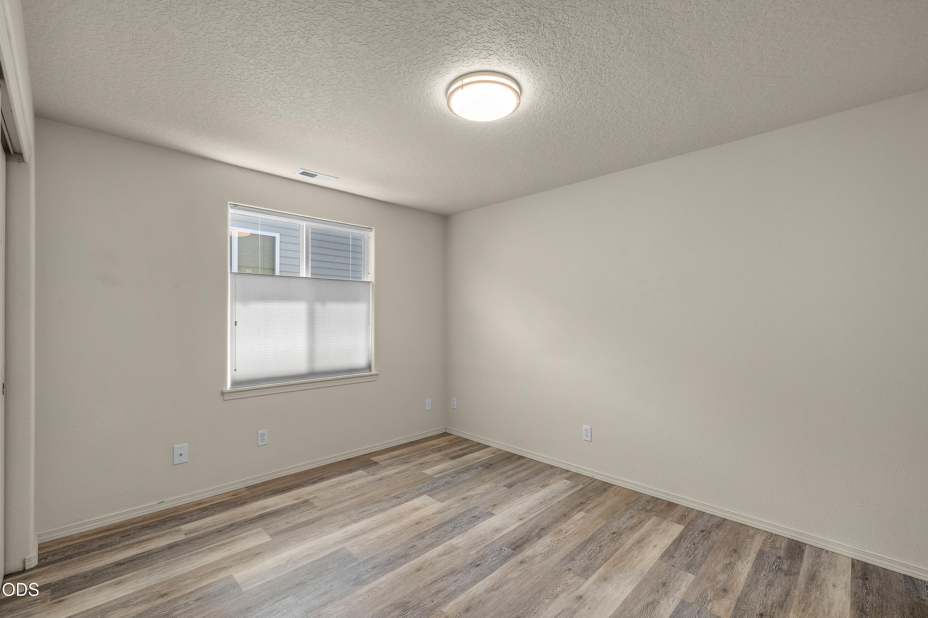 20535 Sunderland Way Bend, OR 97701 - Photo 27 of 41 an empty room with a empty space and windows