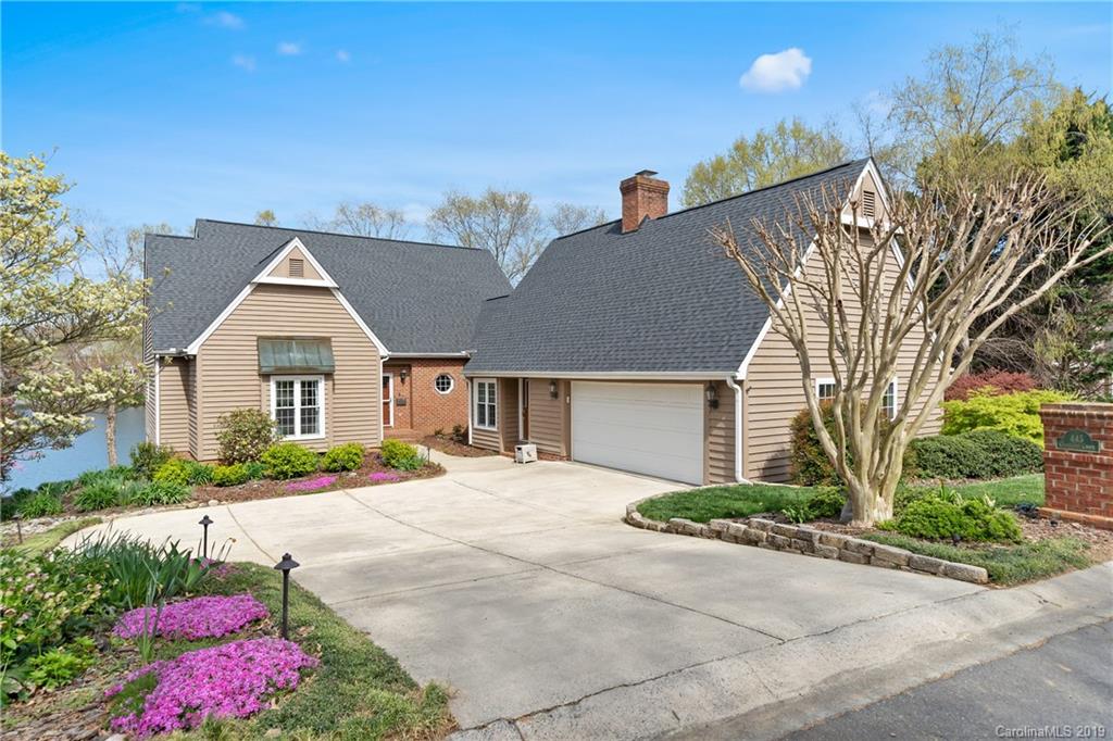 445 Cranborne Chase Fort Mill, SC 29708 - Photo 1 of 33 a front view of a house with a yard and garage