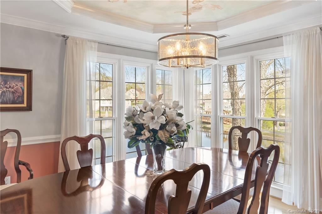 445 Cranborne Chase Fort Mill, SC 29708 - Photo 11 of 33 a view of a dining room with furniture window and chandelier