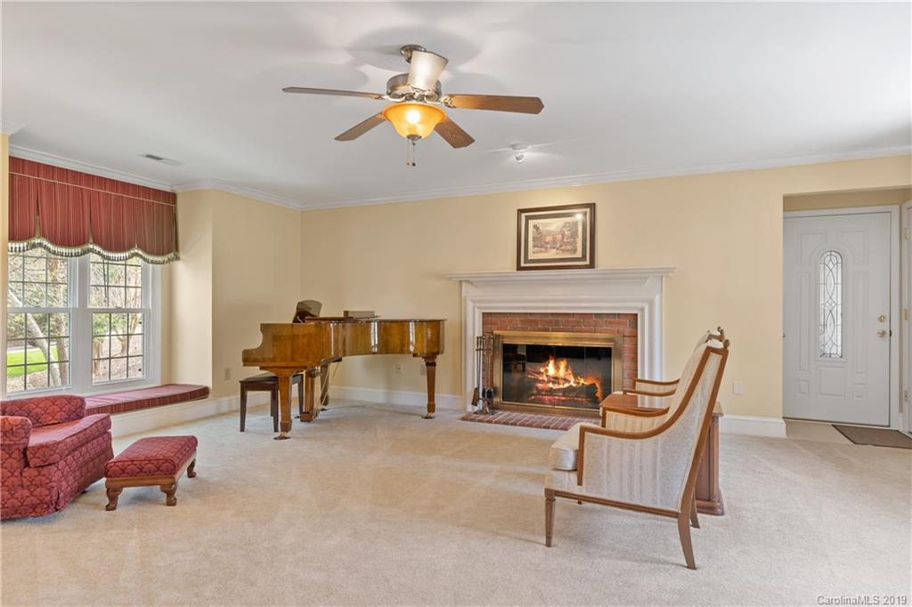 445 Cranborne Chase Fort Mill, SC 29708 - Photo 14 of 33 a living room with furniture and a fireplace