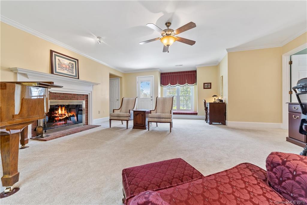 445 Cranborne Chase Fort Mill, SC 29708 - Photo 15 of 33 a living room with furniture and a fireplace