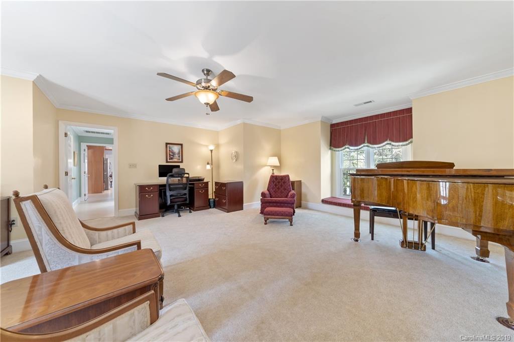 445 Cranborne Chase Fort Mill, SC 29708 - Photo 16 of 33 a living room with furniture and a lamp
