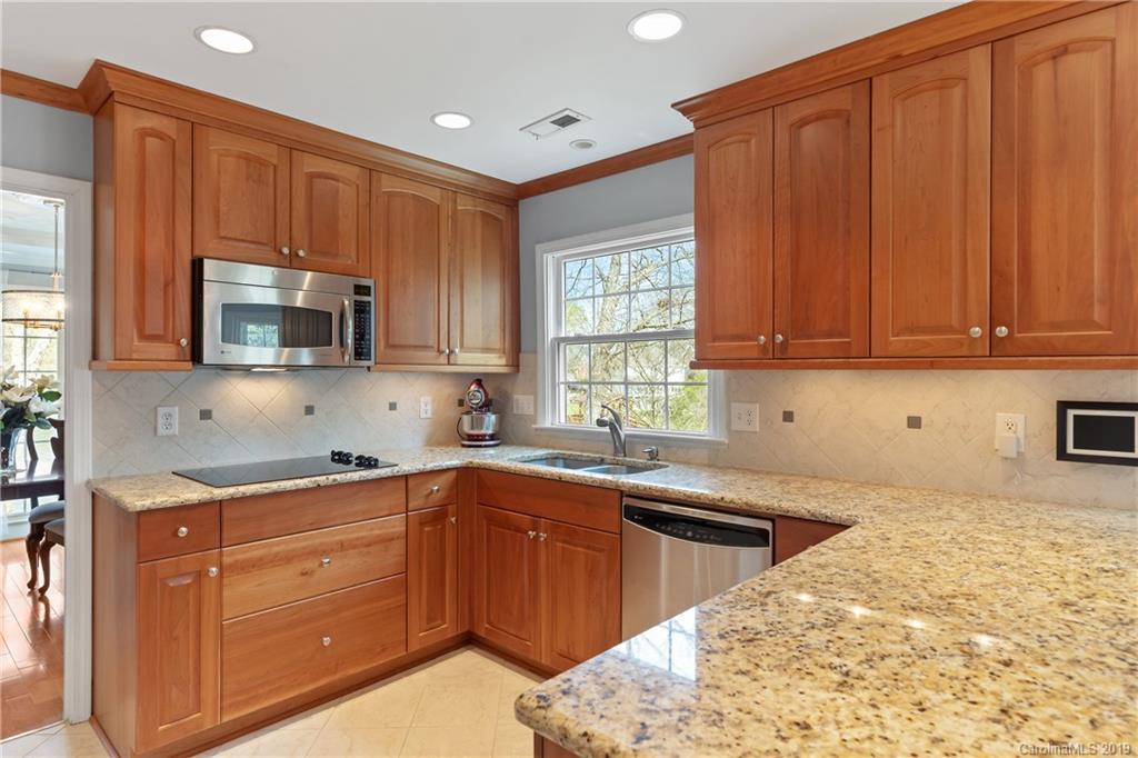 445 Cranborne Chase Fort Mill, SC 29708 - Photo 3 of 33 a kitchen with stainless steel appliances granite countertop a sink stove and microwave
