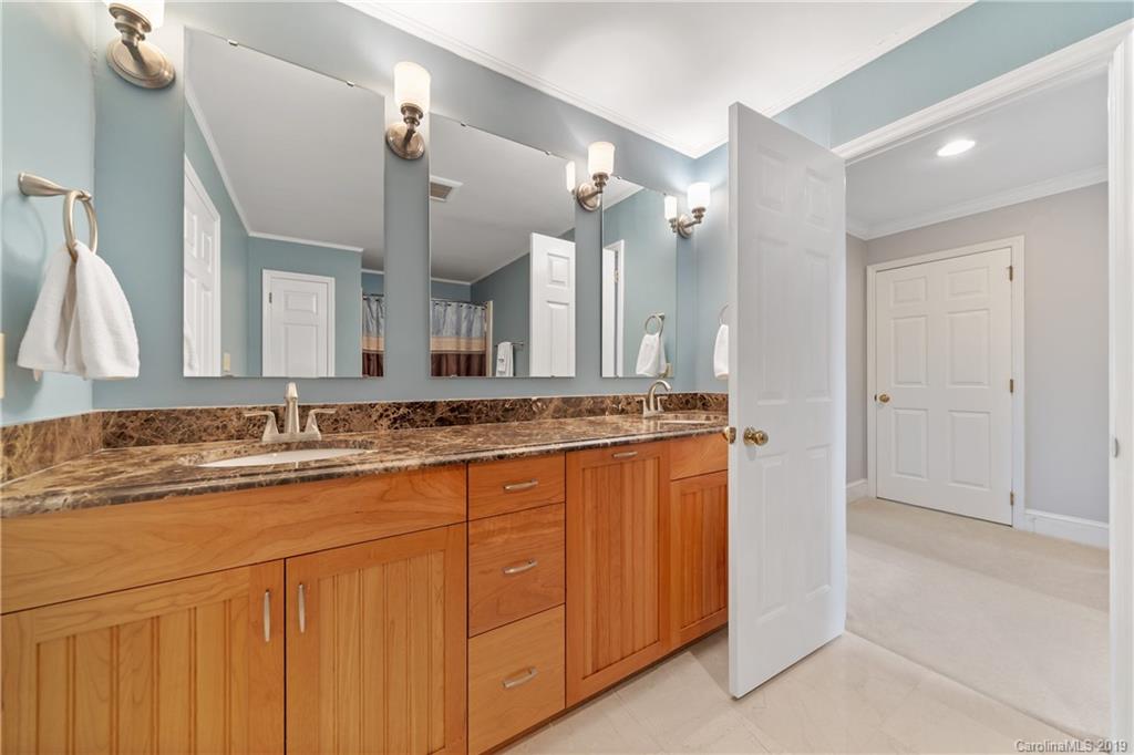 445 Cranborne Chase Fort Mill, SC 29708 - Photo 22 of 33 a bathroom with a granite countertop sink and a mirror