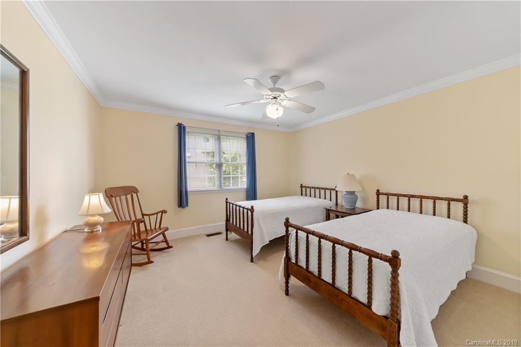 445 Cranborne Chase Fort Mill, SC 29708 - Photo 24 of 33 a bedroom with two beds and window