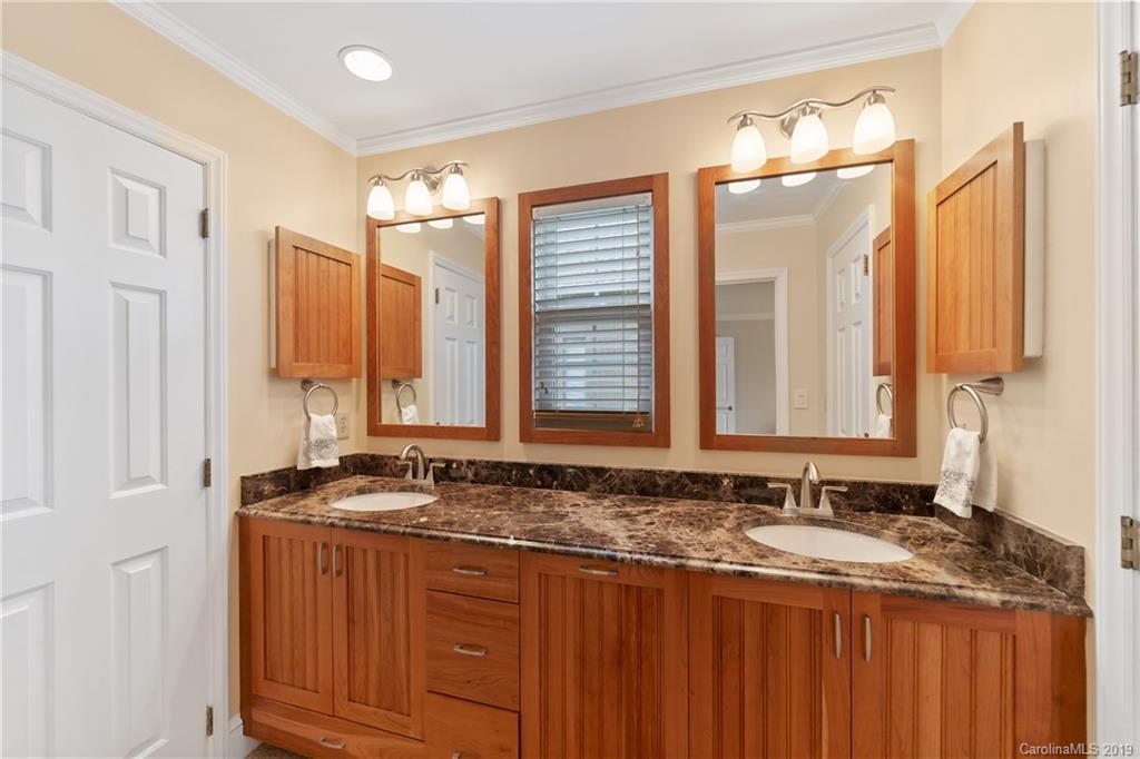 445 Cranborne Chase Fort Mill, SC 29708 - Photo 7 of 33 a bathroom with a granite countertop sink and a mirror
