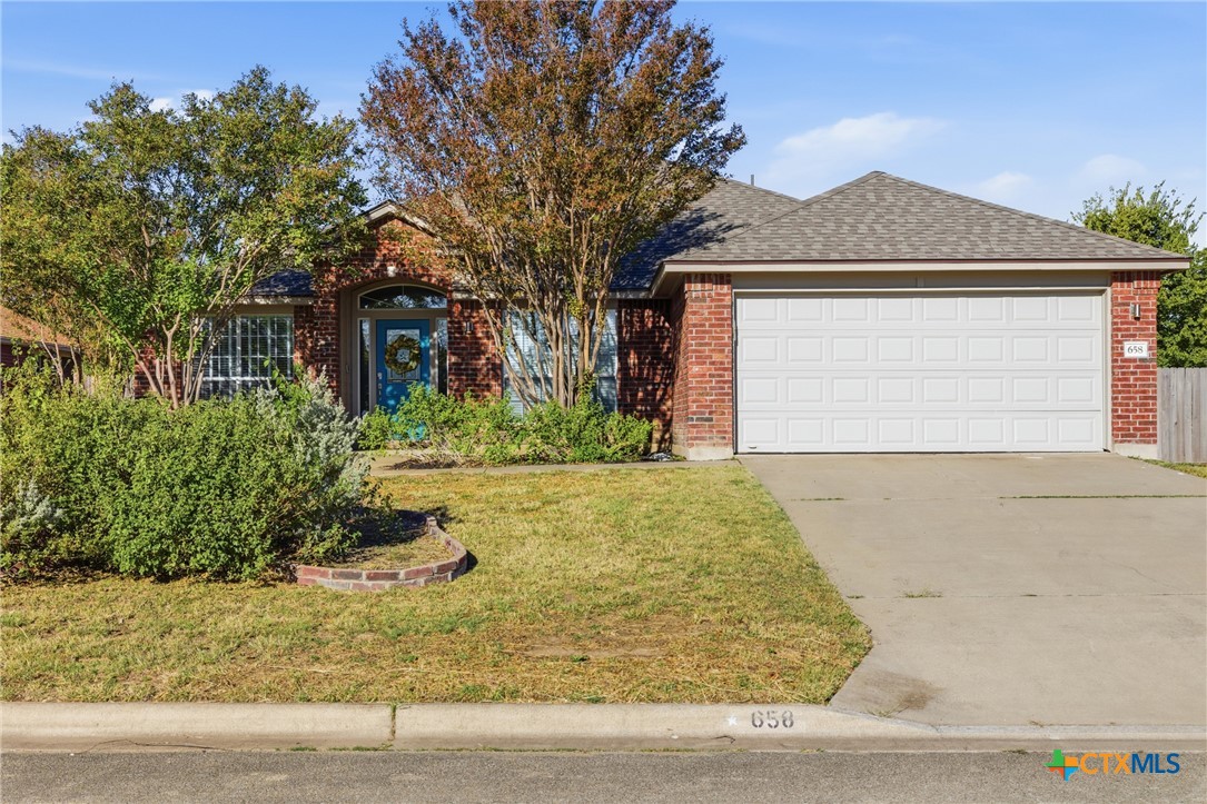 658 Devin Drive Temple, TX 76502 - Photo 5 of 30 a front view of a house with garden