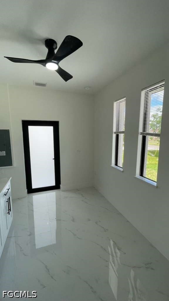 528 Raintree Street East Lehigh Acres, FL 33974 - Photo 2 of 10 a view of an empty room with a window