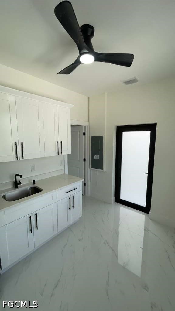 528 Raintree Street East Lehigh Acres, FL 33974 - Photo 3 of 10 a large bathroom with a double vanity sink a mirror and a bathtub