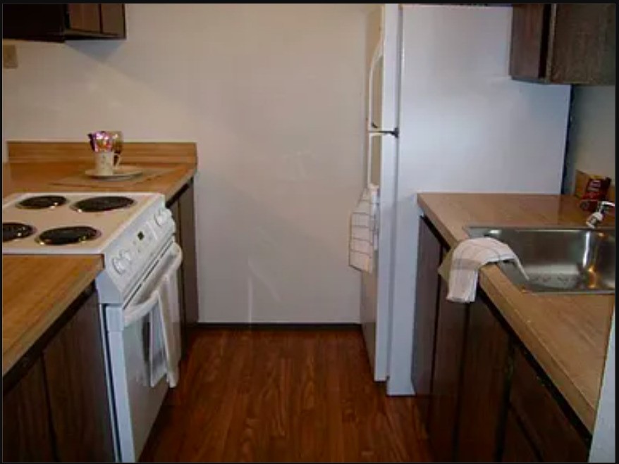 1315 North 18th Street Mount Vernon, WA 98273 - Photo 6 of 9 a kitchen with a stove and a refrigerator