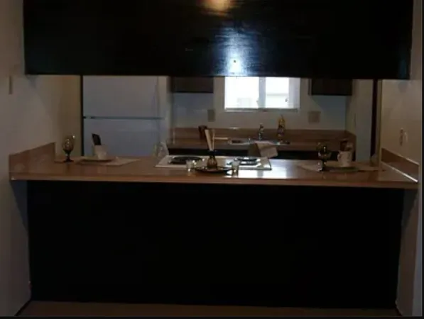 a kitchen with a sink and a microwave