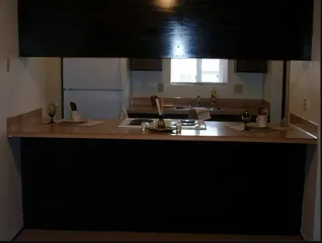 a kitchen with a sink and a microwave