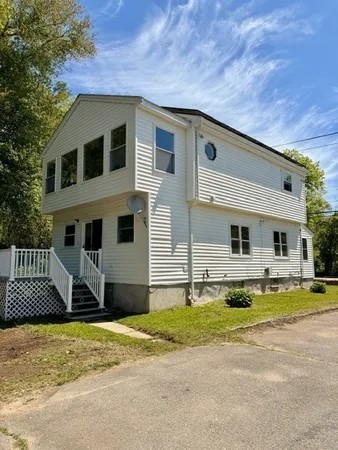 a front view of a house with a yard