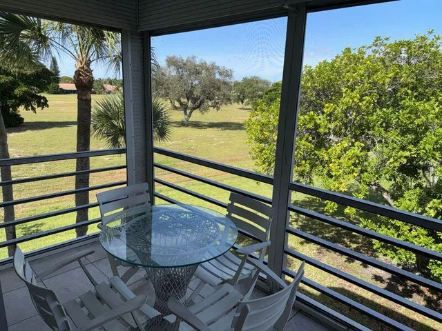 a view of a couple of people sitting on a deck