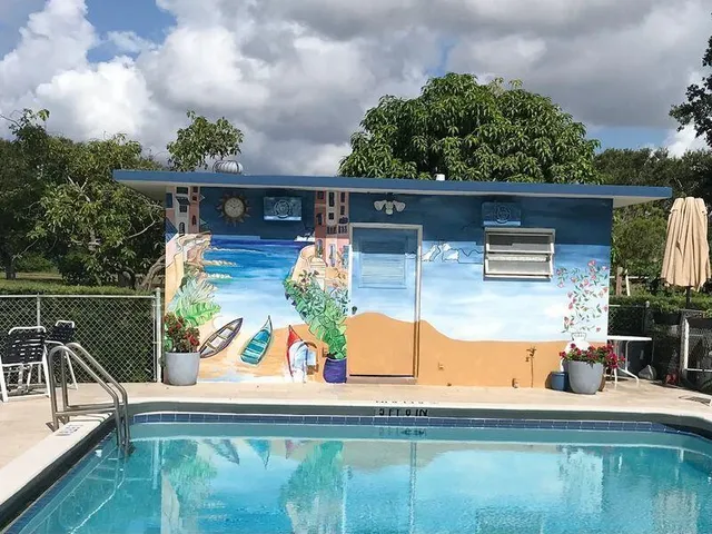 swimming pool view with a seating space