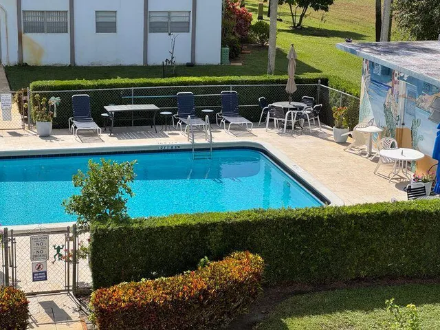 a view of a chairs and table in the patio