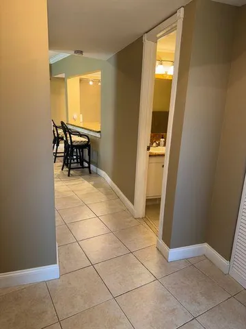 a view of a livingroom with furniture and front door