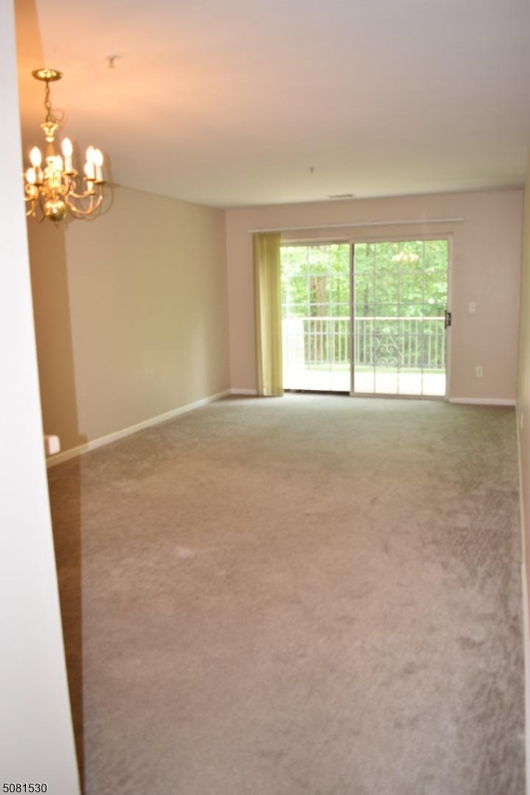 177 Riveredge Drive Chatham, NJ 07928 - Photo 5 of 17 a view of an empty room with a window