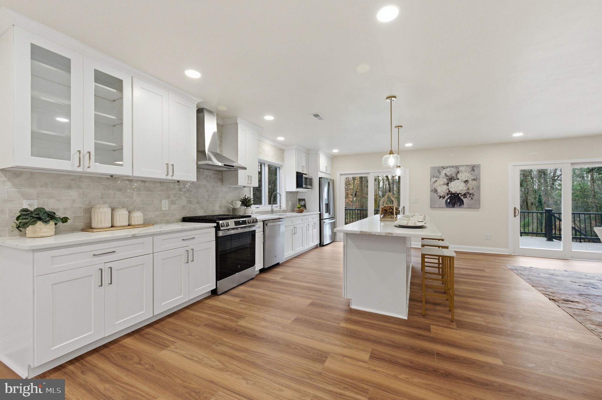 4 Meteor Lane Newark, DE 19711 - Photo 12 of 56 a kitchen with a sink cabinets and wooden floor