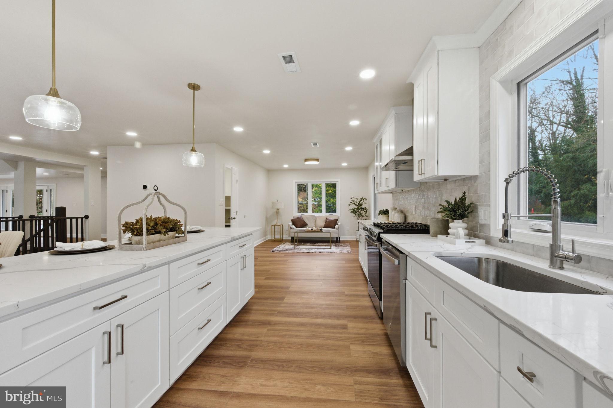 4 Meteor Lane Newark, DE 19711 - Photo 15 of 56 a large kitchen with kitchen island lots of counter space a sink appliances and a large window