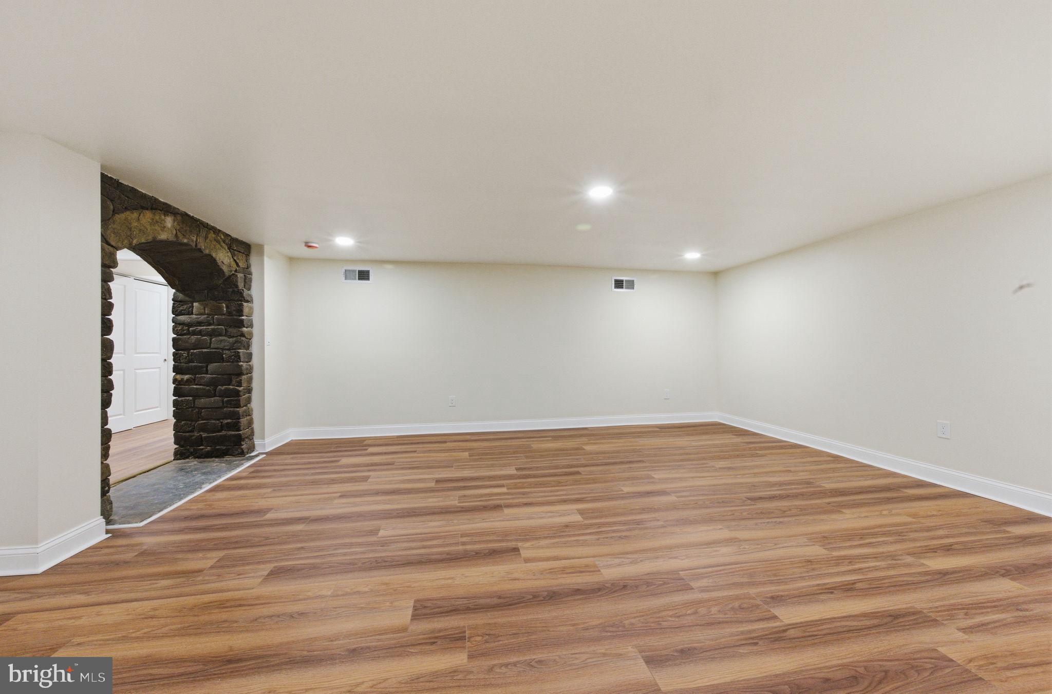 4 Meteor Lane Newark, DE 19711 - Photo 29 of 56 a view of an empty room with wooden floor and a window