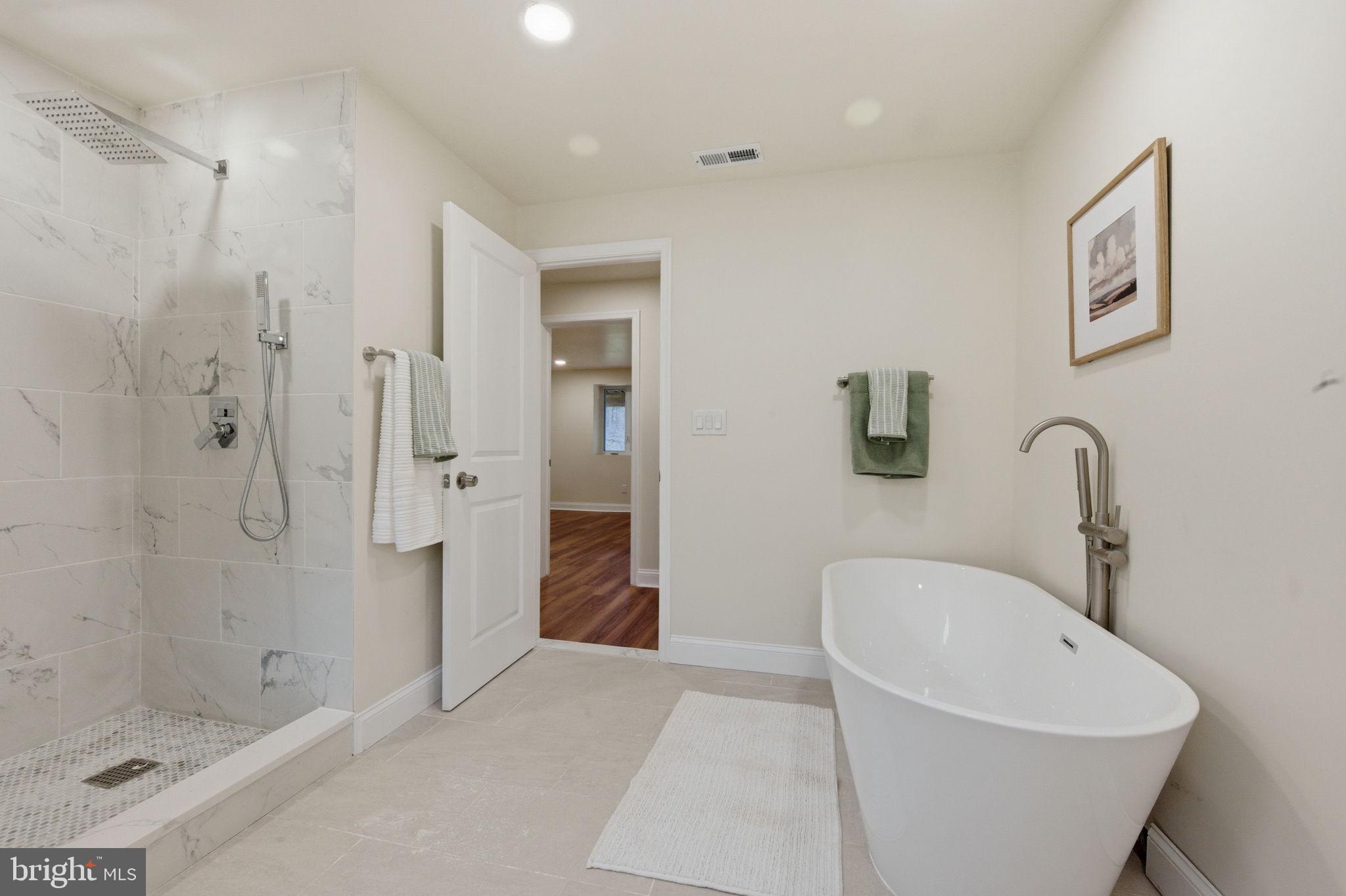 4 Meteor Lane Newark, DE 19711 - Photo 41 of 56 a bathroom with a bathtub and shower