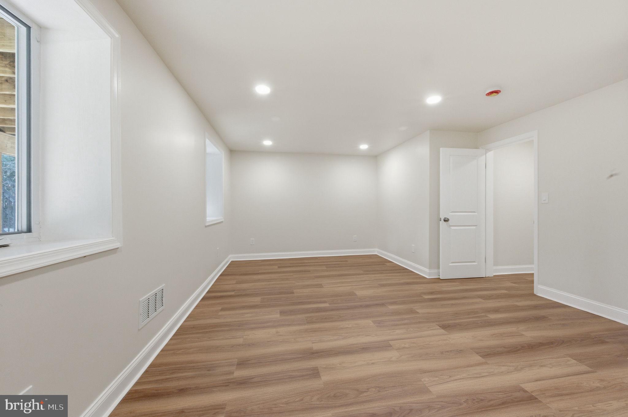 4 Meteor Lane Newark, DE 19711 - Photo 44 of 56 a view of an empty room with wooden floor and a window