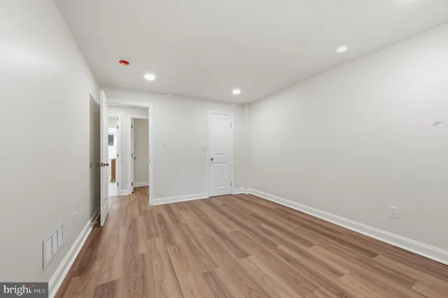 a view of backyard with a deck and wooden floor