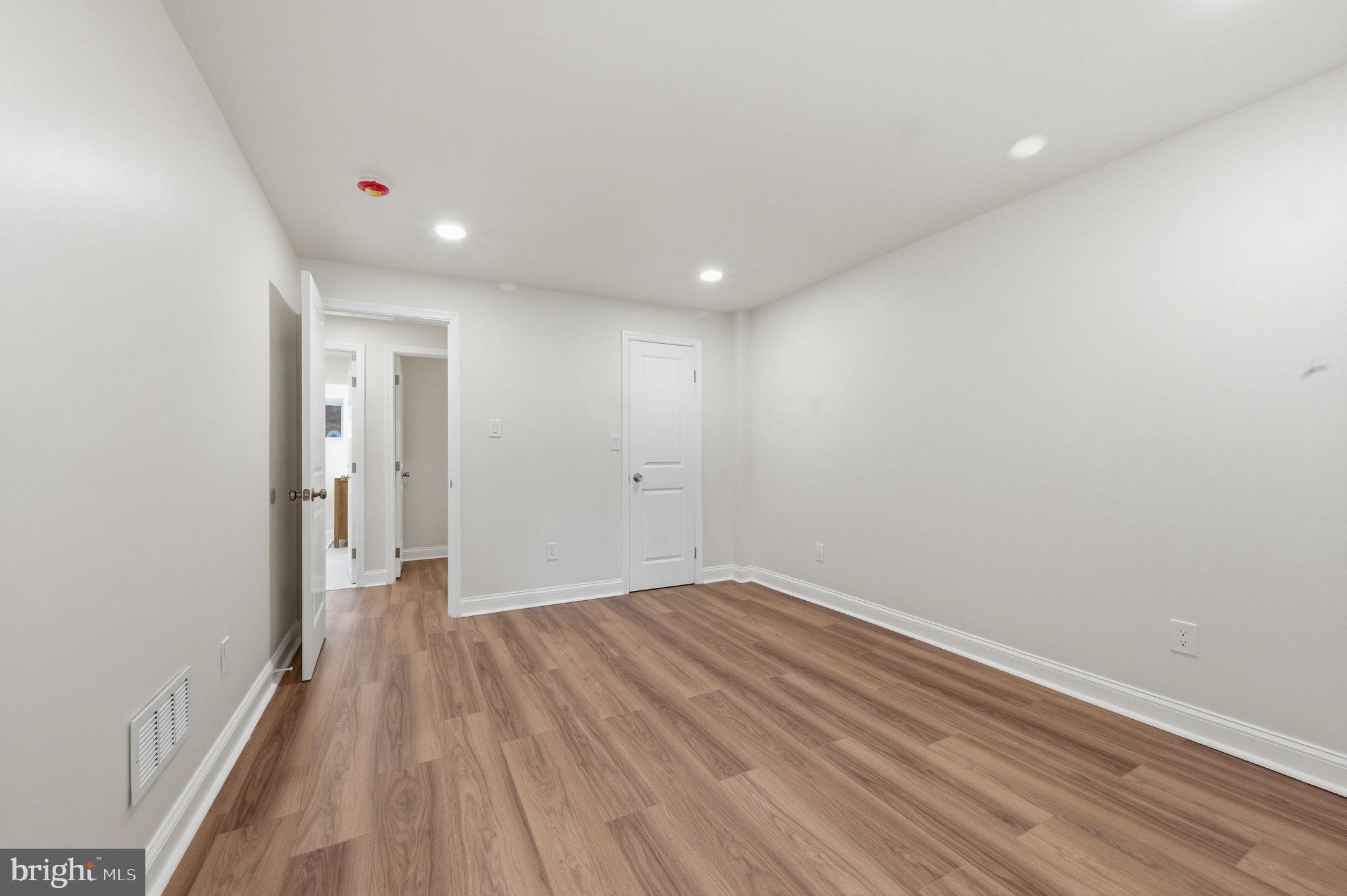 4 Meteor Lane Newark, DE 19711 - Photo 45 of 56 a view of a room with wooden floor and white walls
