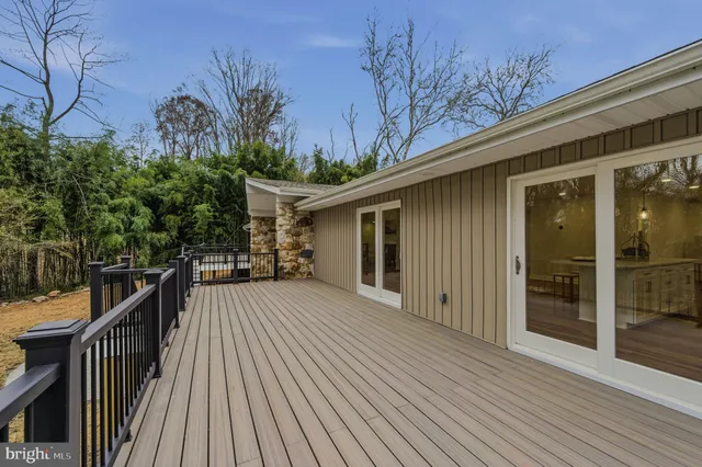 a view of wooden deck with a bench